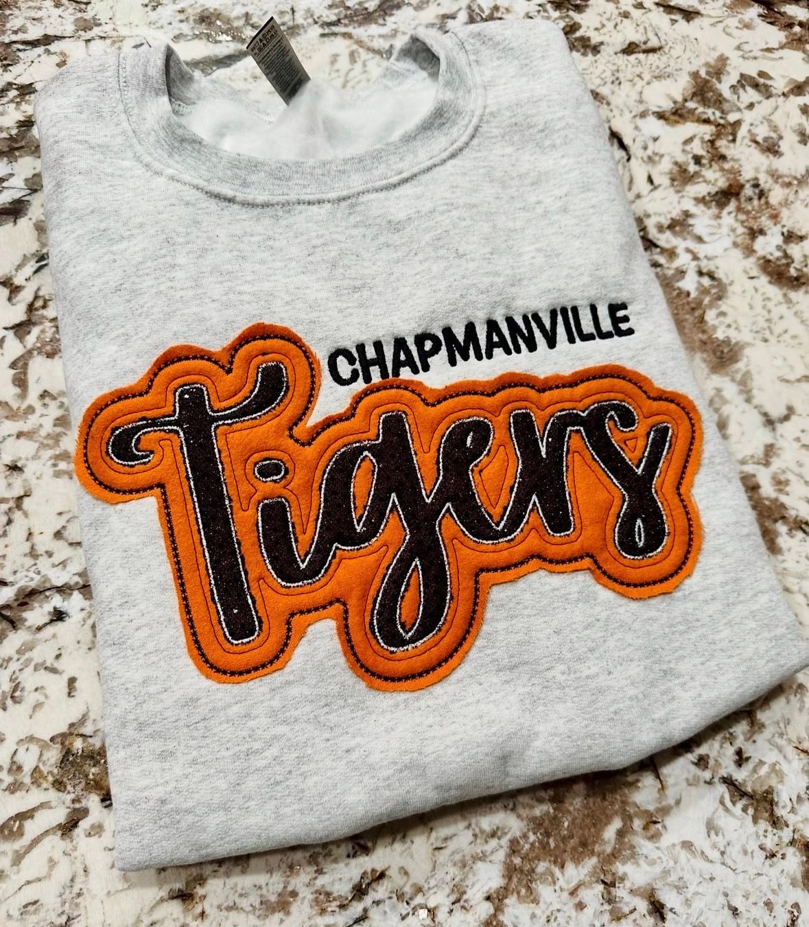 Gray crewneck with Chapmanville Tigers orange appliqué